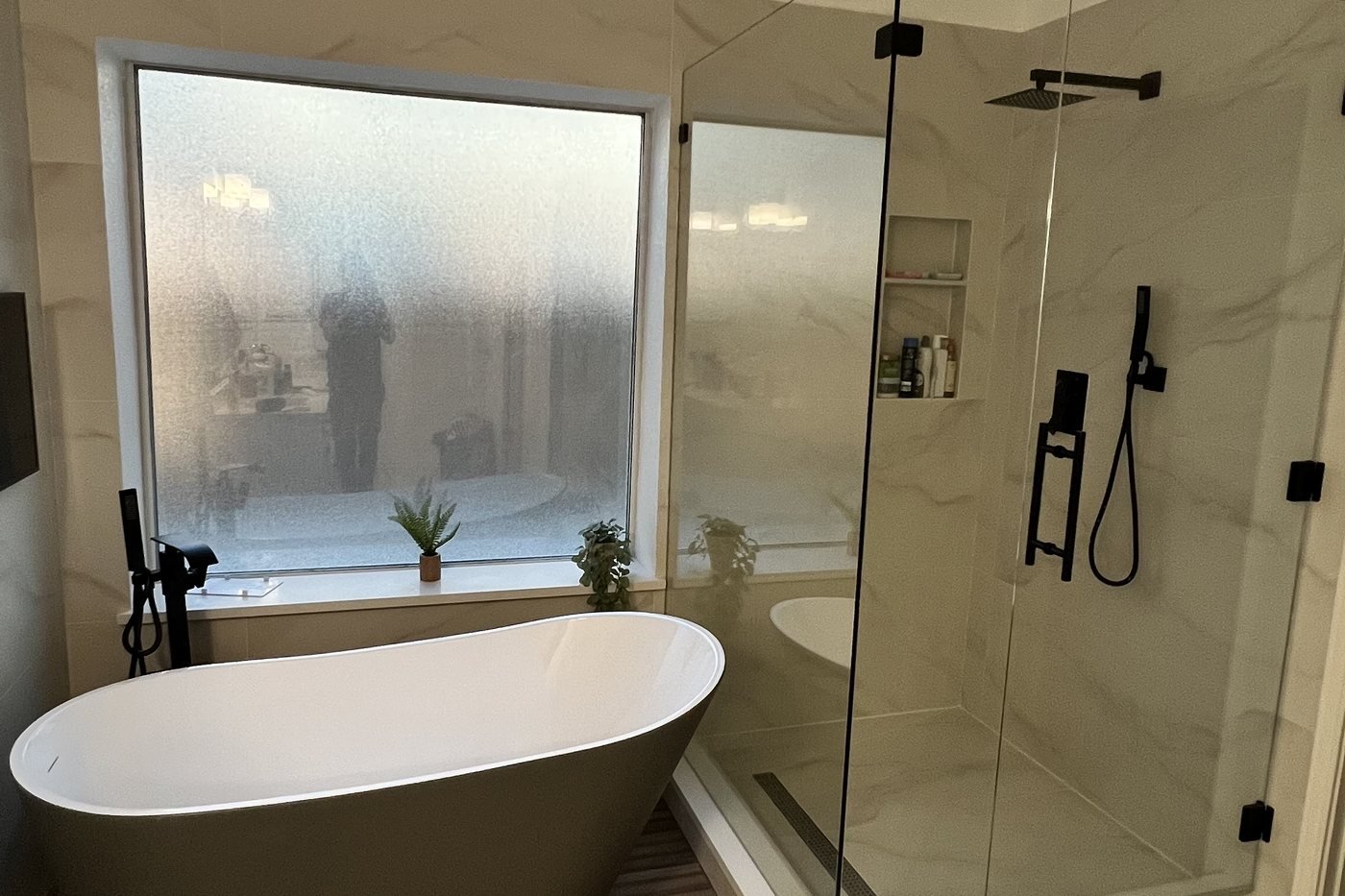 Master bathroom after the BSB remodel: freestanding tub and frameless glass shower
